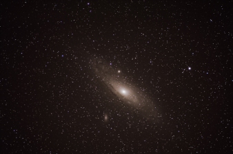 This is the Andromeda Galaxy. At 2.5 million light-years away from the earth, Andromeda is one of the closest galaxies to the Earth. Andromeda is actually fairly large in the night sky, but it is very dim. I took about 840 images with a Nikon 300mm, f2.8 manual focus lens for a combined exposure time of about 7 hours. There are actually three separate galaxies in this image. The small light smudge below Andromeda is a small galaxy called M110. M110 is 2.9 million light-years away from earth. The fuzzy looking “star” on the upper edge of Andromeda is another small galaxy called M32. M32 is 2.65 million light-years away from earth. All the smaller stars in the image are stars in the Milky Way between Earth and Andromeda. These stars are much closer to us and are probably only 50-70 thousand light-years away from Earth.